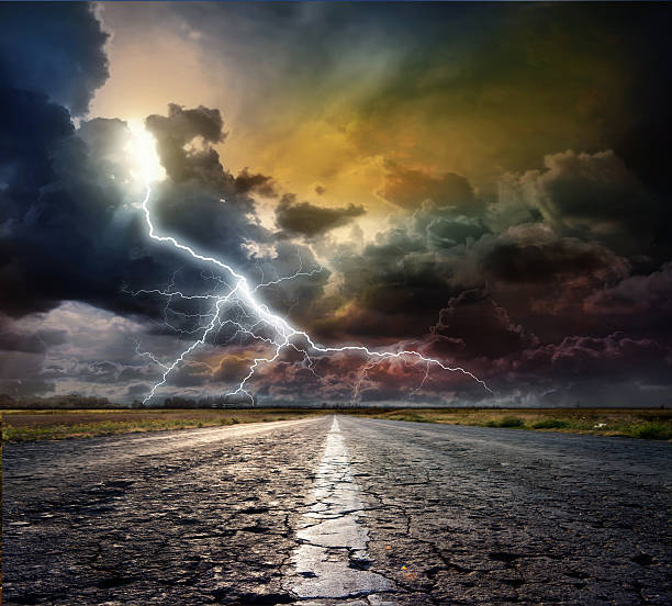 istock country road with lightning 465510441