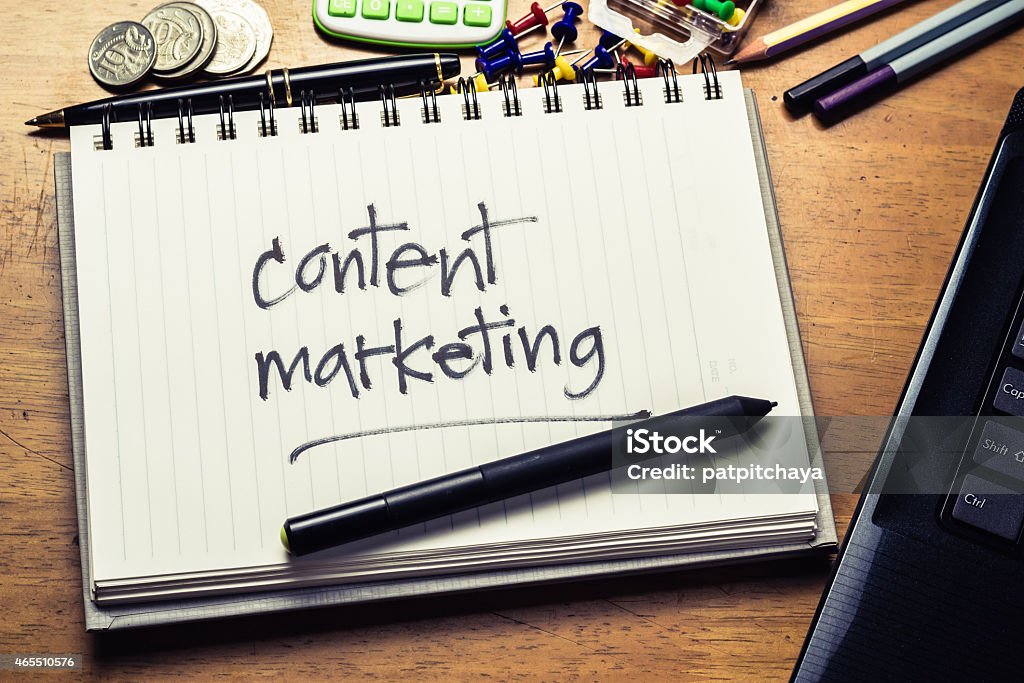 Content Marketing Handwriting of Content Marketing word in notebook on the wood table 2015 Stock Photo