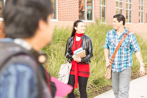 istock Education: Latin college student friends walk to class. 465510655