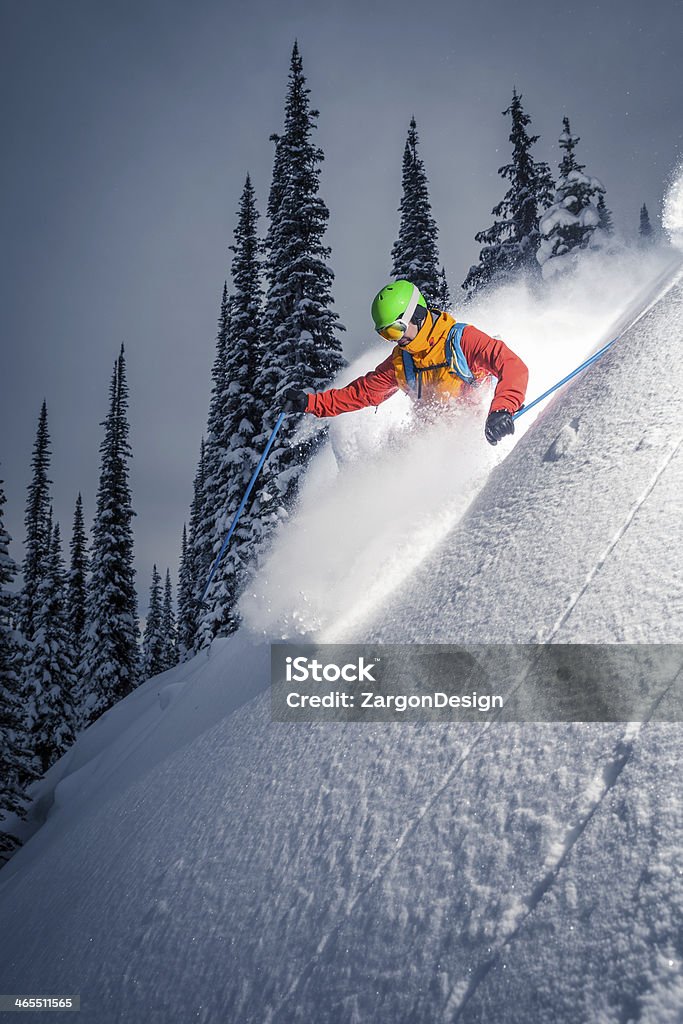 powder skiing Male skier making turn on powder slope. British Columbia Stock Photo