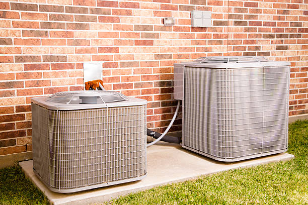 istock Service Industry: Two air conditioner units outside home. 465512223