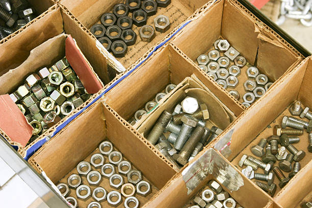 istock Construction: Assortment of many nuts, bolts in small boxes. 465512651
