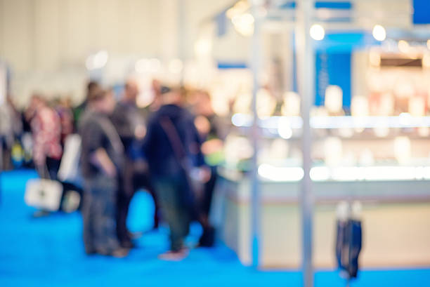 istock People Discussing a Product at a Trade Show 465513102