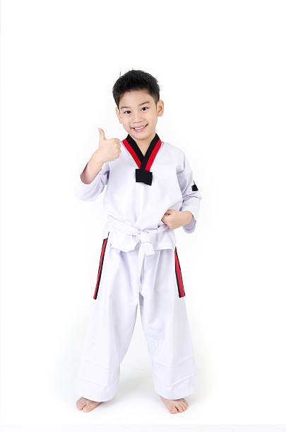 Taekwondo action  by a asian cute boy stock photo