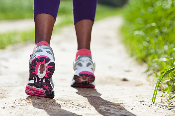 istock Walking /running legs sport shoes. 465514400
