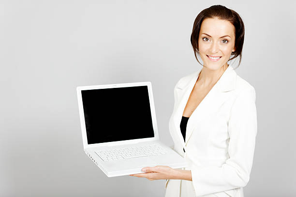 istock woman holding laptop 465515295