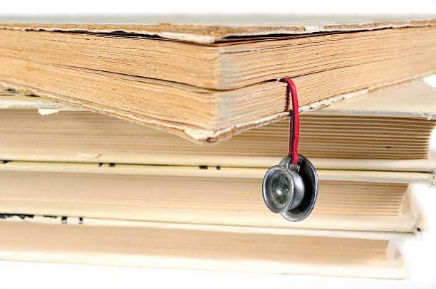 istock Stack of used books with a hand-made bookmark 465516982