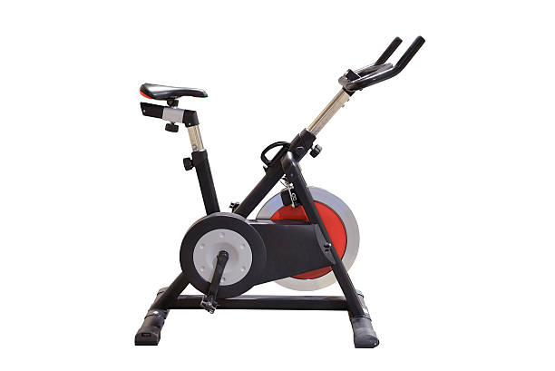 máquinas de ejercicios - bicicleta estática fotografías e imágenes de stock