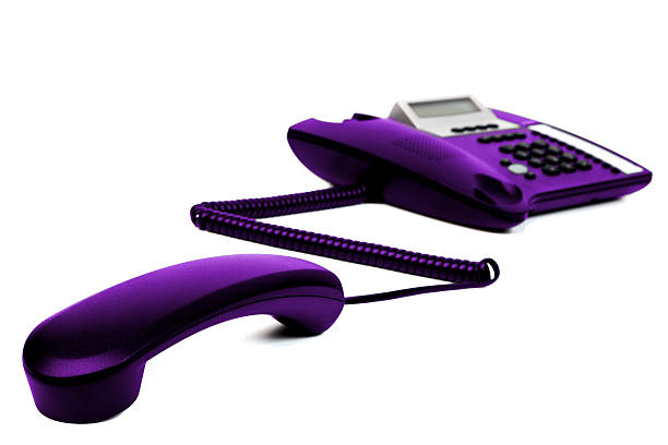 The purple telephone for communication on white background