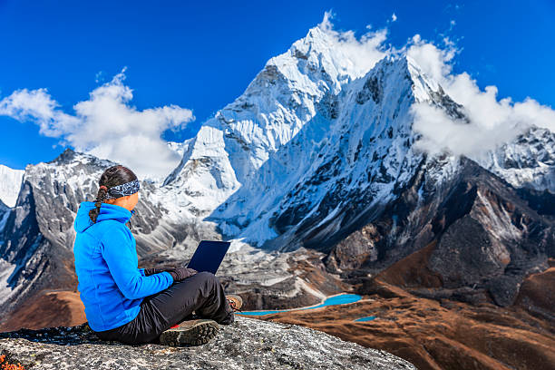 Woman is using laptop in Mount Everest National Park, Nepal