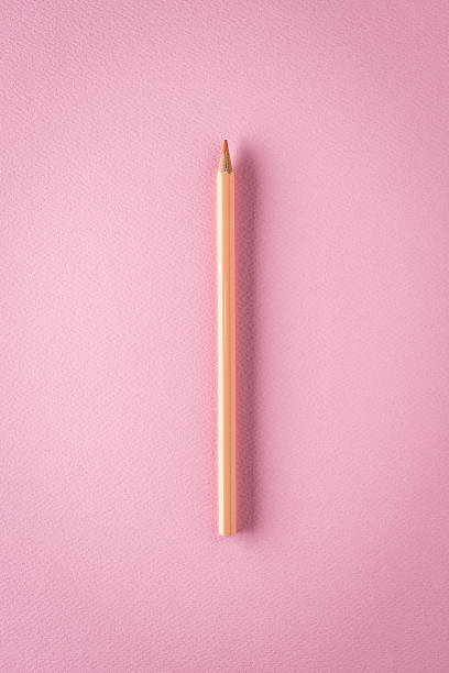 istock Pink crayon on pink paper, minimalist still life 465525062