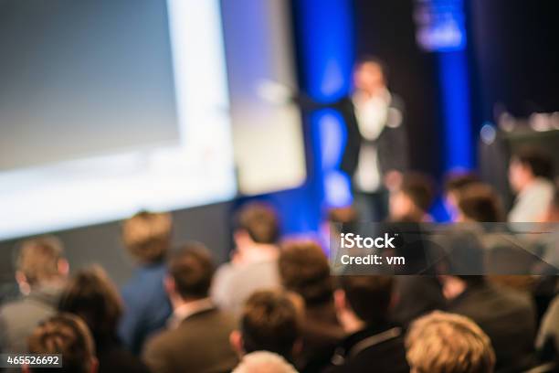 Large Group Of People Listening To A Presentation Stock Photo - Download Image Now - Meeting, Auditorium, Audience