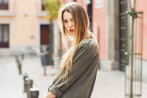 istock Blonde girl urban background 465526864