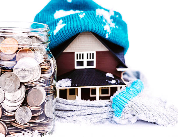 Saving for Winter Housing Costs Saving for Winter Housing Costs winterizing stock pictures, royalty-free photos & images