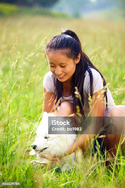 Lovely Asian Young Woman With Her Dog Outdoor Stock Photo - Download Image Now - 20-24 Years, 2015, Adult