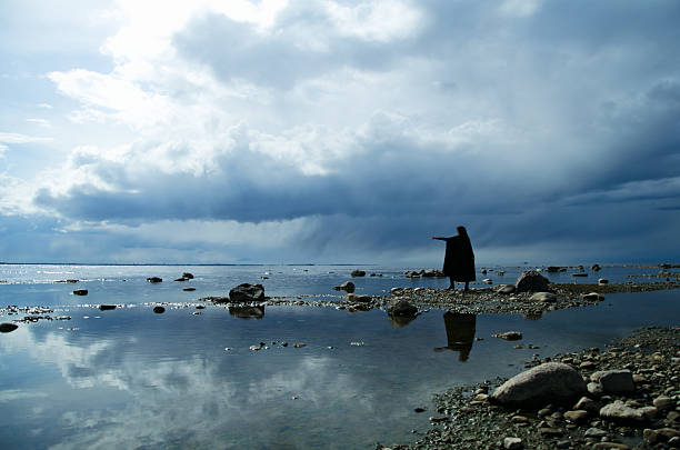 istock girl on a rocky shore 465530096