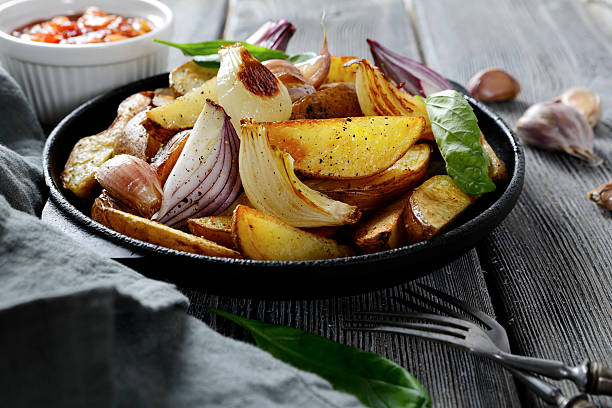 istock Rustic baked potatoes with sauce and onions 465530360