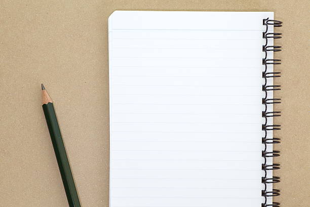 istock Blank notebook and pencil on wooden table 465531772