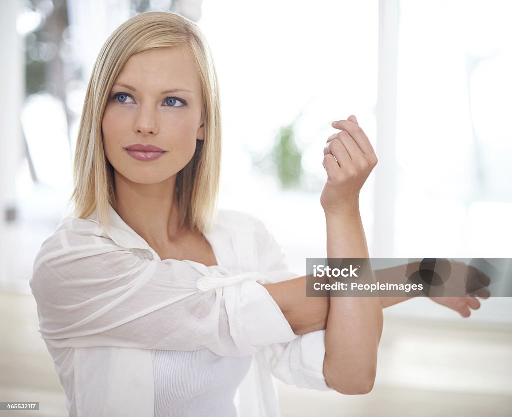 Staying healthy with yoga Shot of a young blonde woman doing yoga stretches 20-24 Years Stock Photo