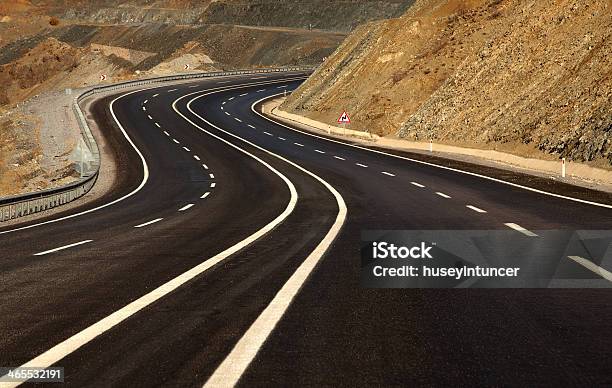 The Winding Road Ahead Stock Photo - Download Image Now - Asphalt, Cloud - Sky, Country Road