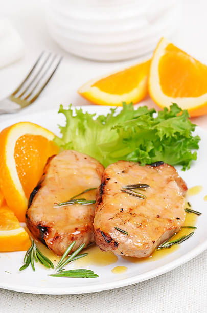 istock Delicious pork chop with orange sauce 465533054