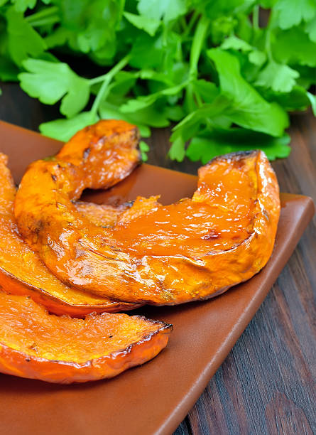 istock Baked pumpkin slices on plate 465533082