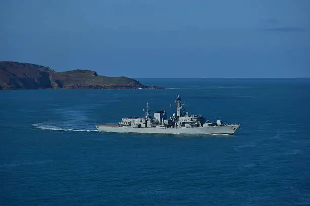 Telephoto image of a Naval frigate patrolling the Channel Islands for over fishing, drug trafficking and military exercises.