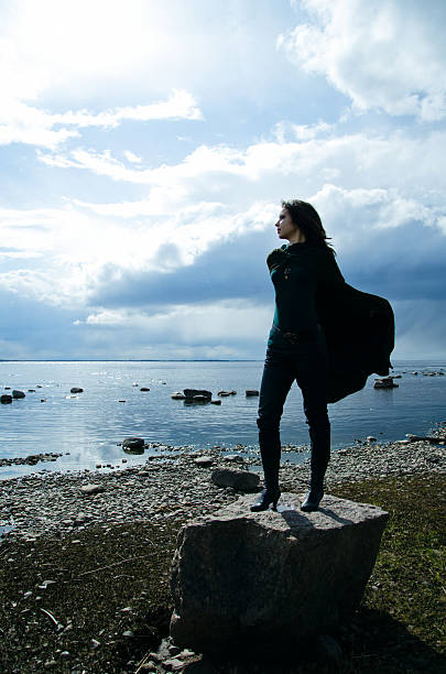 istock girl on a rocky shore 465537252