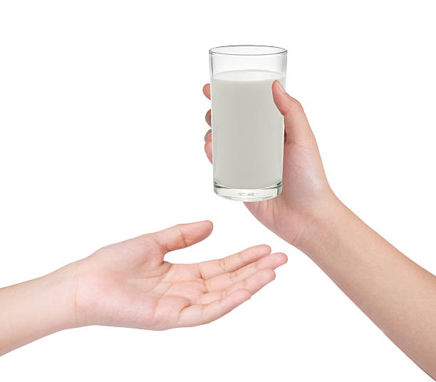 istock Hand holding glass of milk 465537754