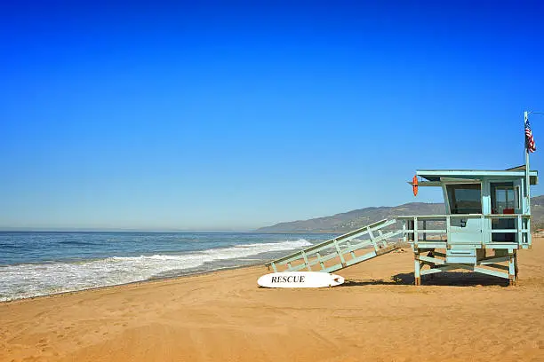 Fantastic golden sand beach with watch tower in Malibu, Los Angeles.
