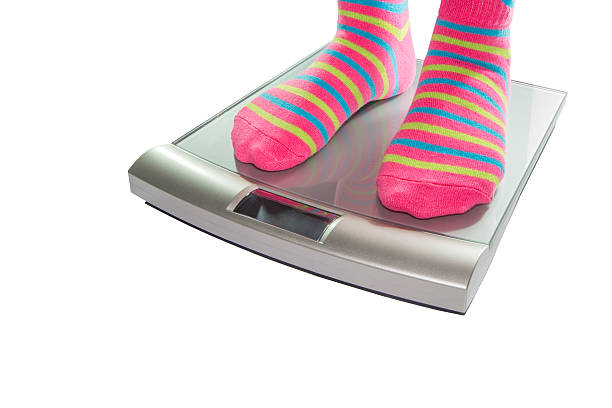 Feet on scales stock photo