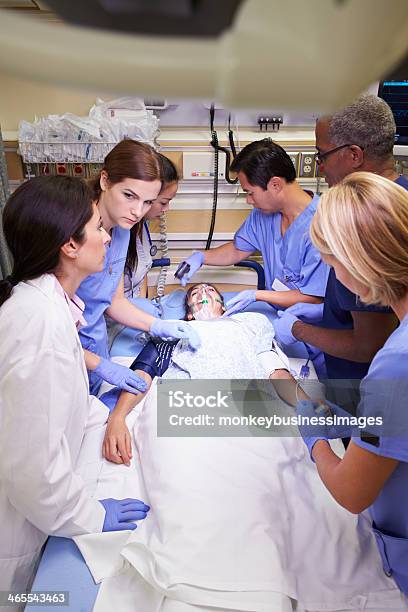 Medical Staff Working On A Patient In The Emergency Room Stock Photo - Download Image Now