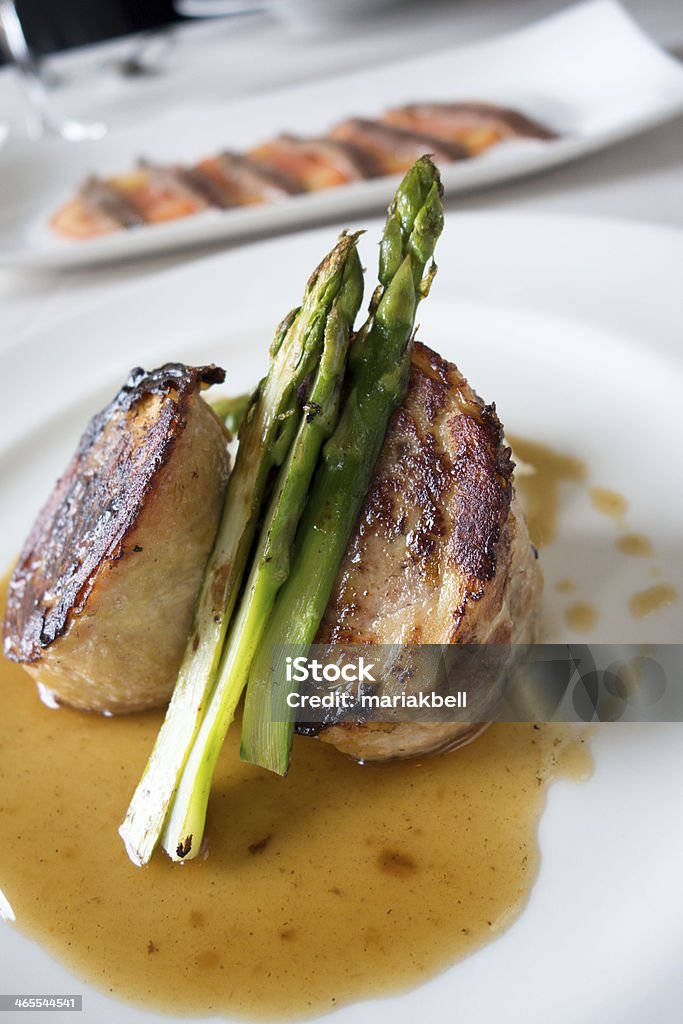 Barcelona Food - Chicken Dish A gourmet dish of stuffed chicken and asparagus Asparagus Stock Photo
