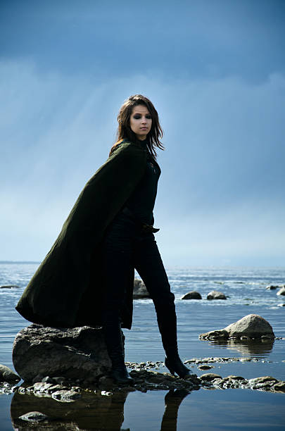 istock girl on a rocky shore 465545006