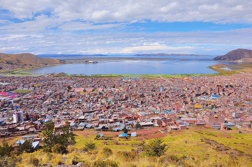 Breathtaking view of Puno by Titicaca lake. Peru. Lake Titicaca is the largest lake in South America and the highest navigable lake in the world.