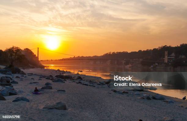 View Of River Ganga And Ram Jhula Bridge At Sunset Stock Photo - Download Image Now - 2015, Architecture, Asia