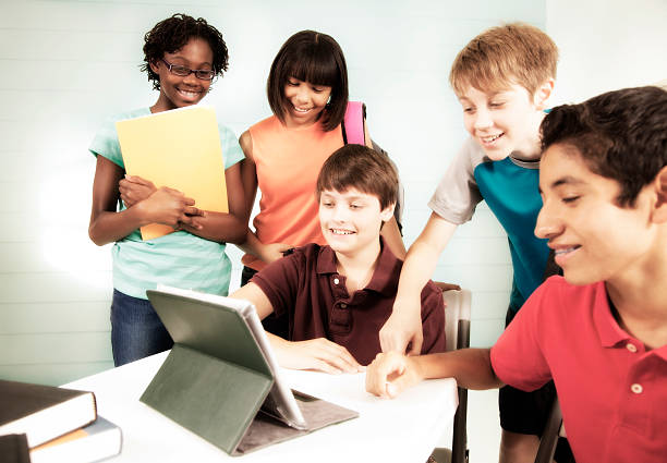 istock Pre-teen friends using digital tablet, internet, social media. 465545837