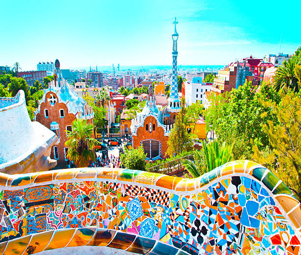 The Famous Summer Park Guell over bright blue sky in Barcelona, Spain