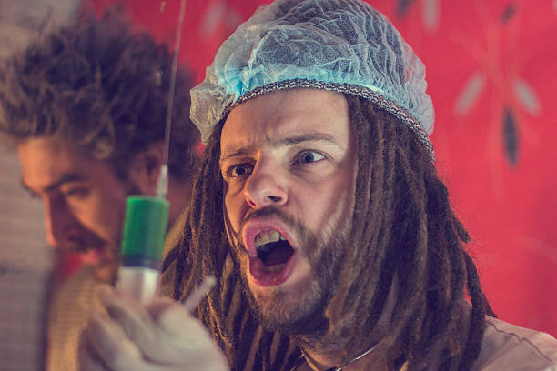 istock Mad Scientist With green Liquid in syringe 465549690