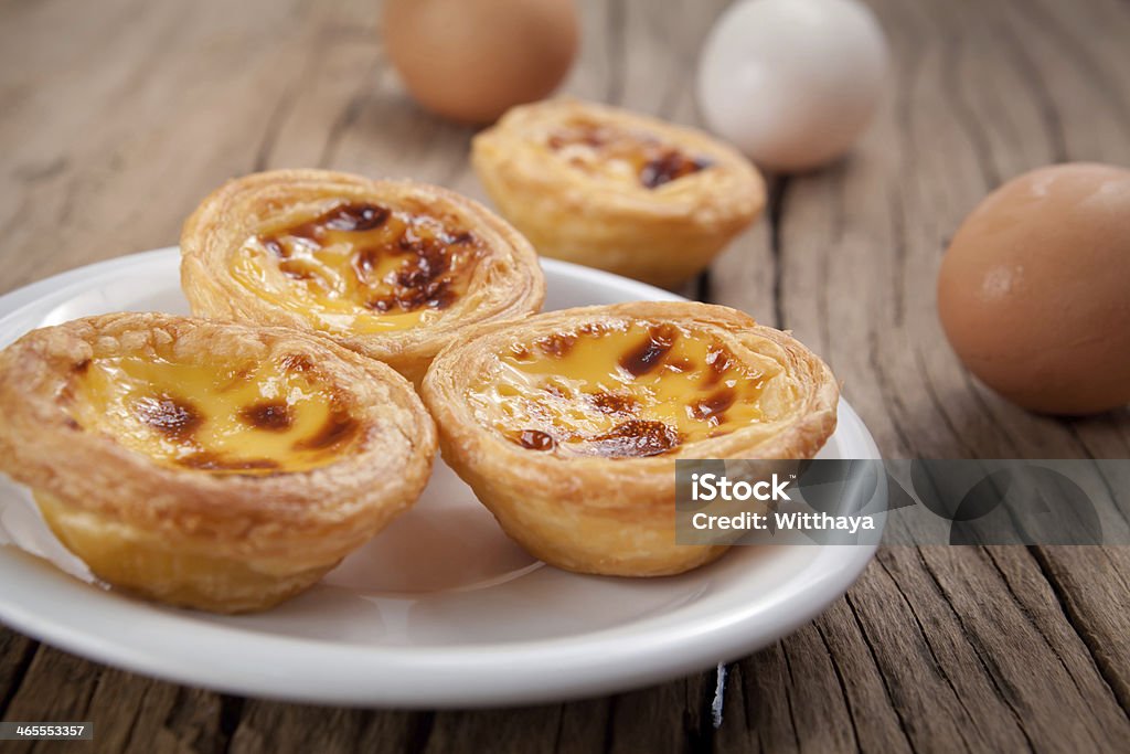 portuguese egg tart delicious portuguese egg tart on wood background Bread Stock Photo