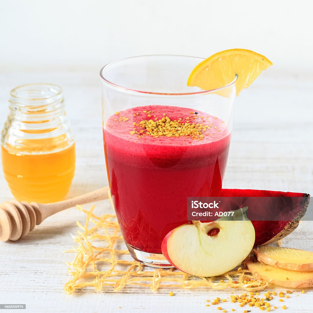 Beetroot ,apple and ginger smoothie Beetroot ,apple and ginger smoothie with honey and pollen 2015 Stock Photo