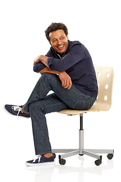 istock Mature guy sitting relaxed on chair looking away 465556259