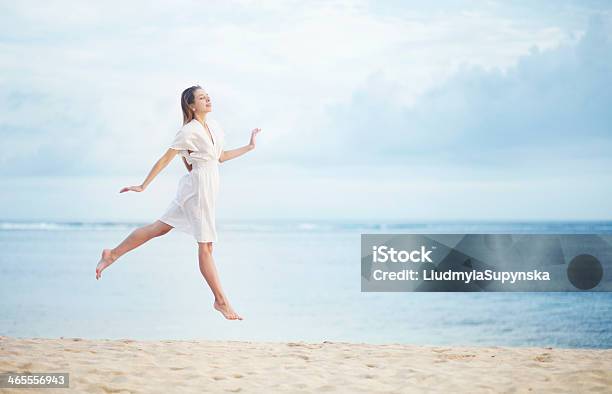 Young Woman On The Ocean Shore In White Dress Stock Photo - Download Image Now - Beach, One Woman Only, Women