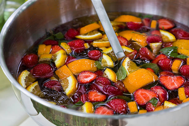 istock mixed punch with fruits in metal bowl 465560253
