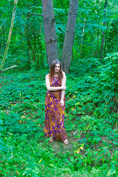istock Pretty young woman standing in deep forest 465561209