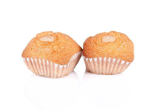 istock Pair of cupcakes over white isolated background 465570921