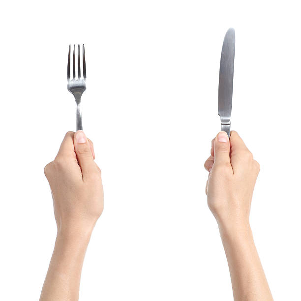 istock Woman hands holding a fork and knife 465575057