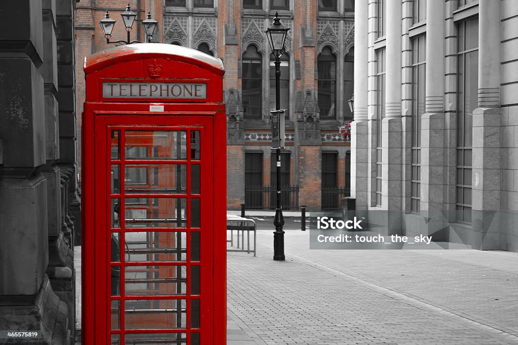 Red Phone Booth A traditional British red phone booth on one of the more quiet streets of Birmingham. Stylised Photo. Birmingham - England Stock Photo
