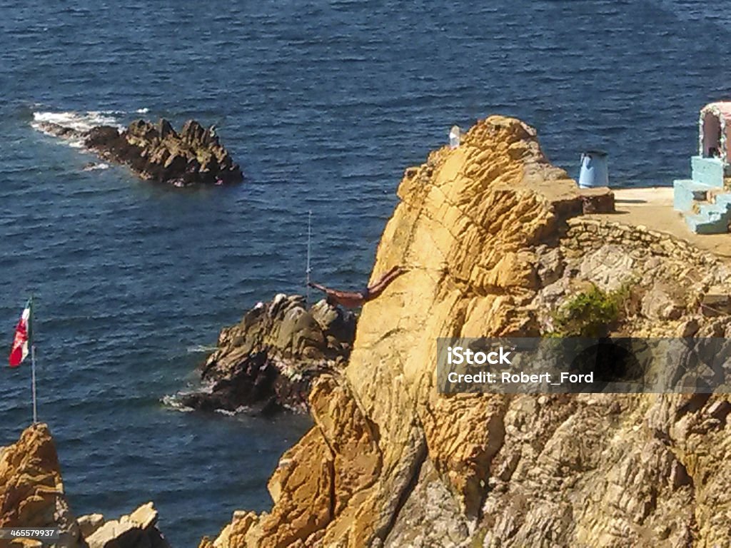 Diver off Cliffs in Acapulco mexico Diver in the air diving off Cliffs in Acapulco mexico Acapulco Stock Photo