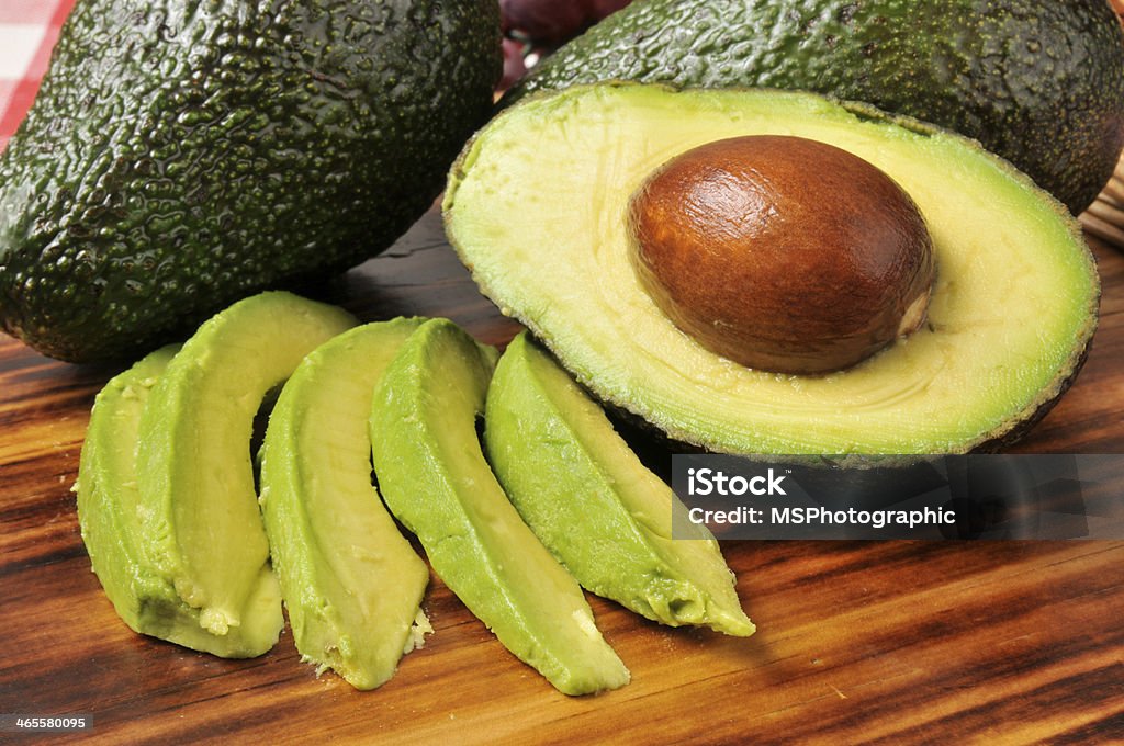 Avocado slices Sliced avocado on a cutting board Avocado Stock Photo